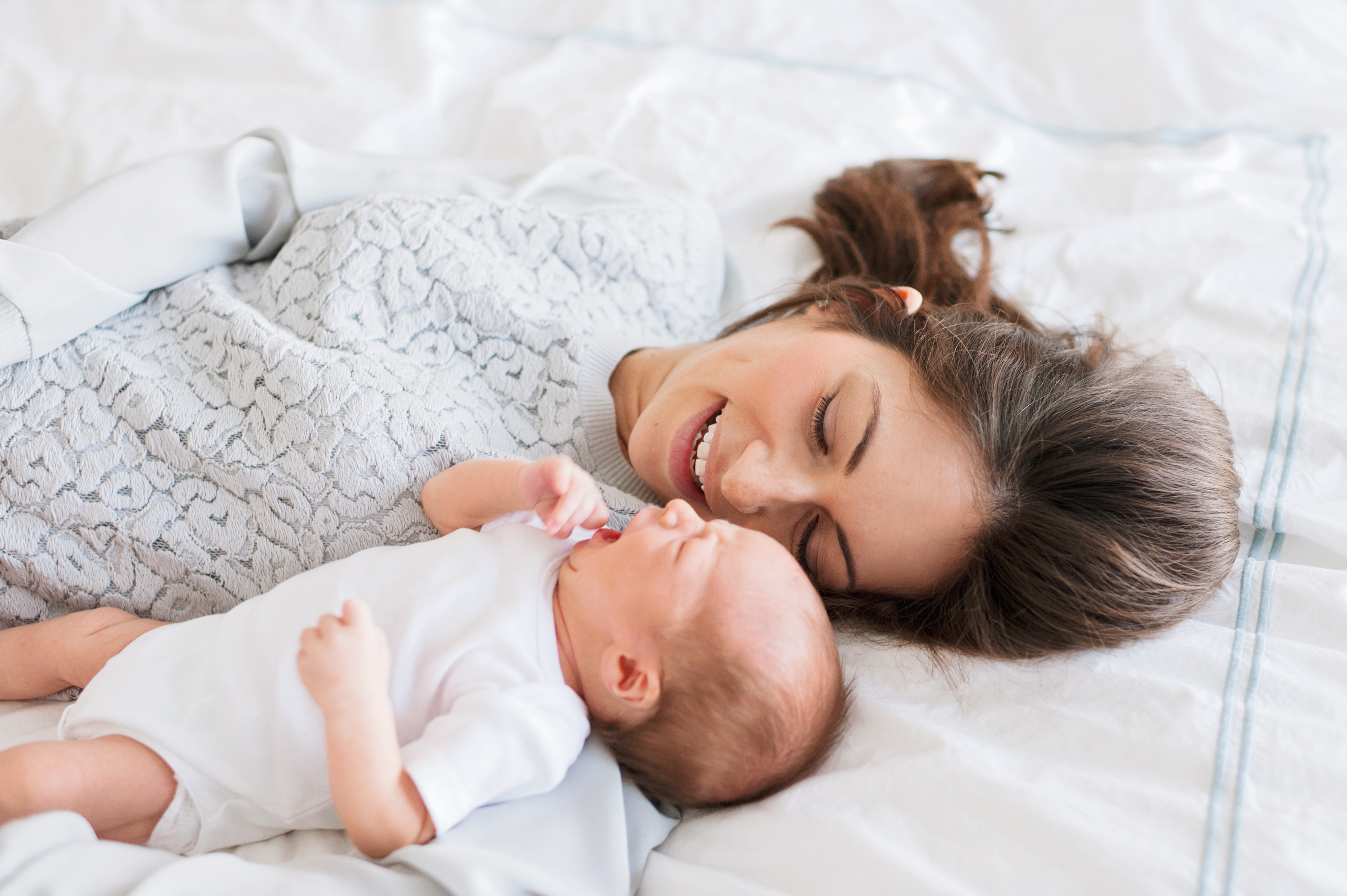 mother and newborn sun at Dallas lifestyle newborn session by Dallas family photographer Cristy Angulo